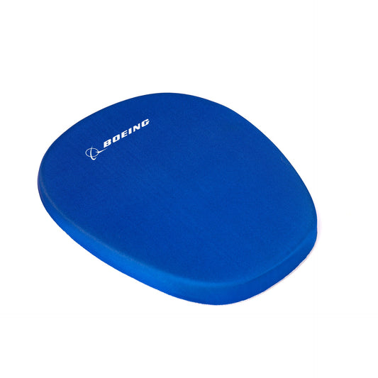 The Boeing Memory Sponge Mousepad from The Boeing Store is a blue ergonomic mousepad with a memory sponge, featuring the white Boeing logo and name on the top left corner—ideal for any computer mouse.