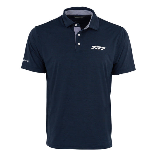 The Boeing 737 Series Men’s Polo by BOEING is a navy blue, moisture-wicking shirt with “737” in white on the left chest and “Boeing” on the sleeve. It features a folded collar, three-button placket, and keeps you cool and dry all day.