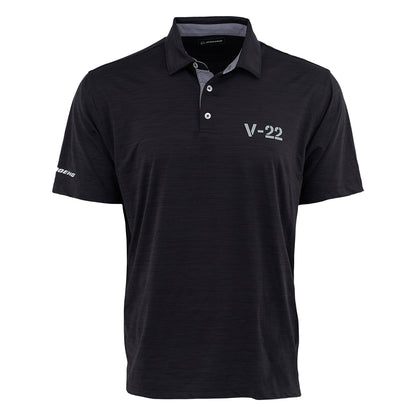 The Boeing V-22 Osprey Series Men’s Polo by BOEING is a black, short-sleeve polo with a collar and three buttons, featuring “V-22” on the chest and “Boeing” on the sleeve. It offers UPF 50 sun protection for all-day comfort.