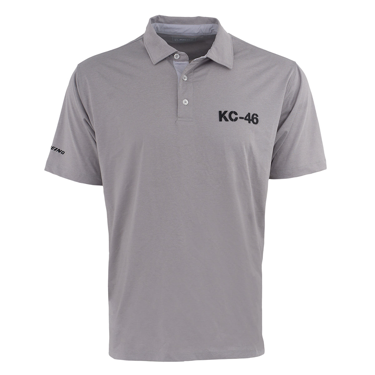 The Boeing KC-46A Pegasus Series Men’s Polo by BOEING features light gray, short sleeves, a collar with three buttons, black KC-46 on the left chest, Boeing logo on the sleeve, and moisture-wicking fabric to keep you cool and dry.