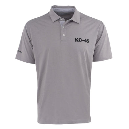 The Boeing KC-46A Pegasus Series Men’s Polo by BOEING features light gray, short sleeves, a collar with three buttons, black KC-46 on the left chest, Boeing logo on the sleeve, and moisture-wicking fabric to keep you cool and dry.