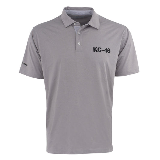 The Boeing KC-46A Pegasus Series Men’s Polo by BOEING features light gray, short sleeves, a collar with three buttons, black KC-46 on the left chest, Boeing logo on the sleeve, and moisture-wicking fabric to keep you cool and dry.