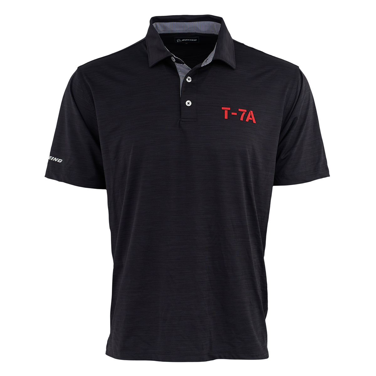 The Boeing T-7A Red Hawk Series Men’s Polo by BOEING is a black short-sleeve polo with a collar, three buttons, “T-7A” in red on the left chest, “Boeing” on the right sleeve, UPF 50 sun protection, and a subtle textured pattern.