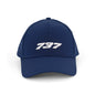 The BOEING 737 Series Hat is a navy blue baseball cap with a bold white 3D 737 logo on the front panel and a textured surface for added style.