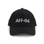 The BOEING AH-64 Apache Series Hat is a black cap with “AH-64” in bold white letters on the front, inspired by the legendary aircraft. It features an adjustable Velcro closure and is shown against a plain white background.