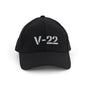 The BOEING V-22 Osprey Series Hat is a black cap with a bold, light gray 3D V-22 logo on the front. It features a curved brim, mesh sides, and an adjustable velcro closure for comfort.