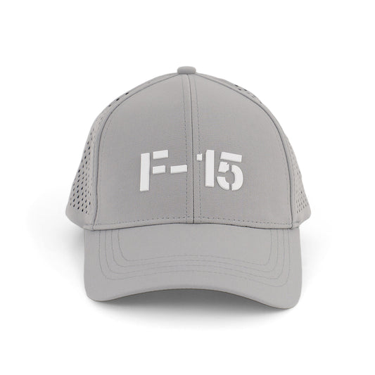 The BOEING F-15 Eagle Series Hat is a light gray textured cap with a bold white F-15 logo on the front and perforated side panels for ventilation.