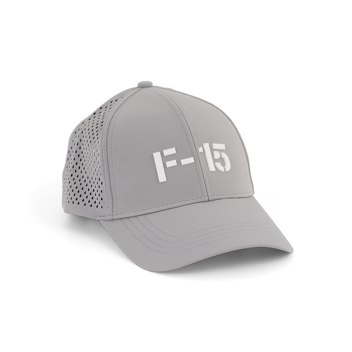 The Boeing F-15 Eagle Series Hat by BOEING is a light gray baseball cap with perforated side panels and F-15 in bold white letters on the front, shown at an angle against a white background.