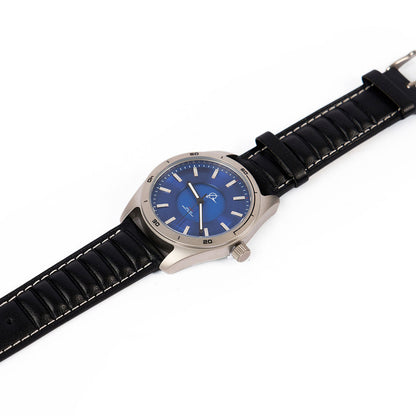 The Boeing Store's Boeing Symbol Men's Solar Watch 42 mm features a silver case, blue face with silver markers, black leather strap with white stitching, and precise Japanese solar movement, shown on a white background.