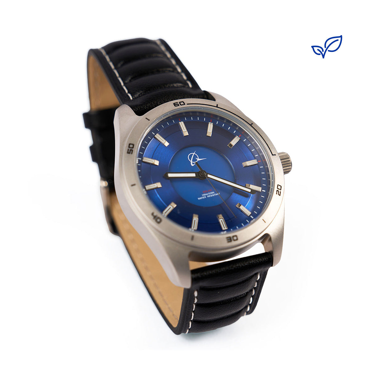 The Boeing Store’s Boeing Symbol Men's Solar Watch 42 mm features a blue face, silver bezel, white hour markers, and a black leather AppleSkin strap. The watch is angled to display its face and strap, with a small blue leaf logo at the top right.