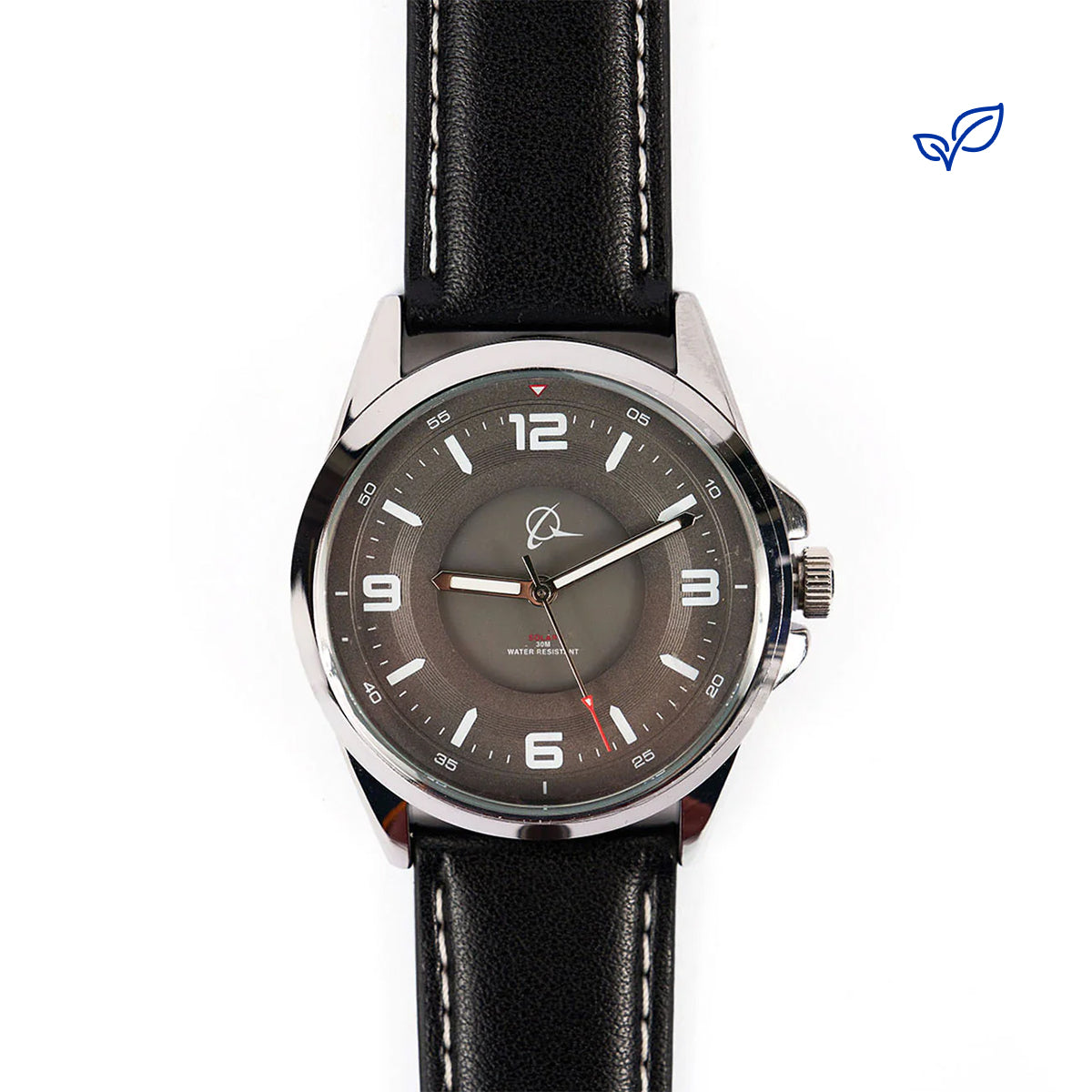 The Boeing Symbol Mens Solar Black Watch 42 mm by The Boeing Store, featuring Japanese solar movement, a black leather strap, silver case, gray dial with white hour markers and red second hand, is shown on a white background with a small blue leaf logo in the top right.