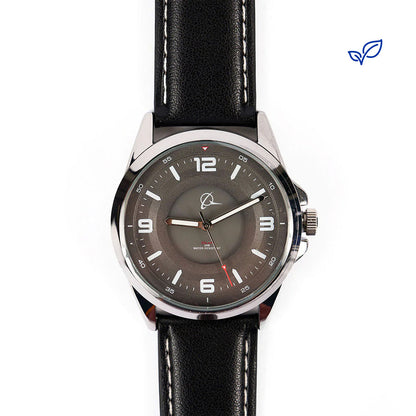 The Boeing Symbol Mens Solar Black Watch 42 mm by The Boeing Store, featuring Japanese solar movement, a black leather strap, silver case, gray dial with white hour markers and red second hand, is shown on a white background with a small blue leaf logo in the top right.