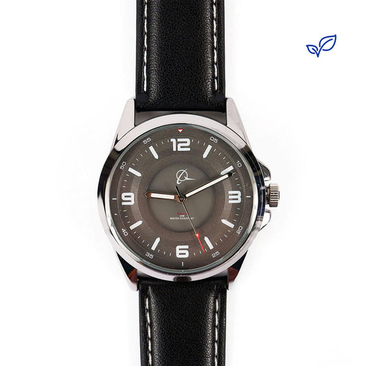 The Boeing Symbol Mens Solar Black Watch 42 mm by The Boeing Store, featuring Japanese solar movement, a black leather strap, silver case, gray dial with white hour markers and red second hand, is shown on a white background with a small blue leaf logo in the top right.