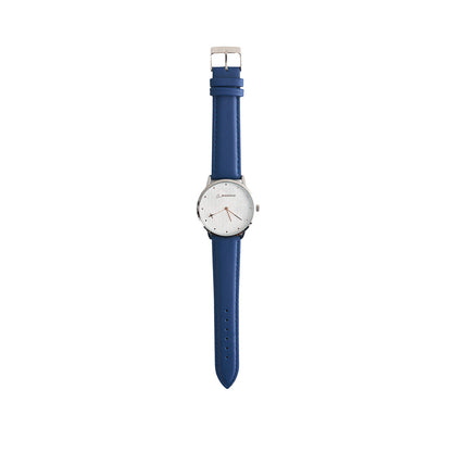 The Boeing Men's Rotating Watch by BOEING features a white round dial, silver bezel, minimalistic design, blue leather strap, Japan quartz movement, and silver hands that contrast with the plain white face.