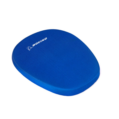 The Boeing Memory Sponge Mousepad from The Boeing Store is a blue ergonomic mousepad with a memory sponge, featuring the white Boeing logo and name on the top left corner—ideal for any computer mouse.