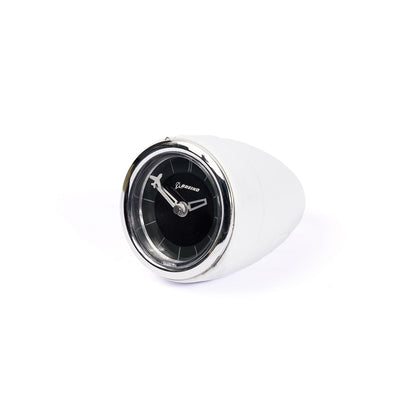 The Boeing Airplane Engine Desktop Clock by Boeing features a black face, silver rim, and Boeing logo, set in a white rounded holder that resembles an airplane engine and is angled slightly right on a white background.
