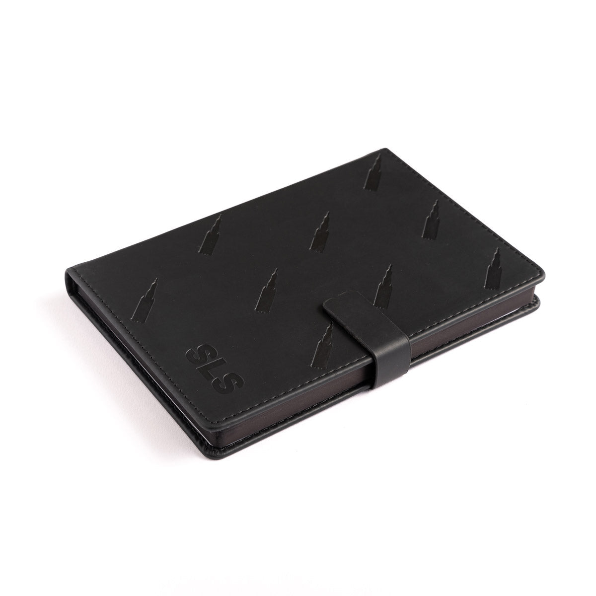 The Boeing Stores Boeing SLS Notebook is a sleek, black leather notebook with a subtle embossed pattern and clasp closure. It features SLS in the corner and offers a stylish, professional look perfect for aviation enthusiasts and reminiscent of Boeings aircraft precision.