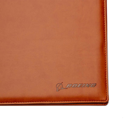 Close-up of the Boeing Basic Padfolio from The Boeing Store, featuring brown PU leather and the embossed Boeing logo in the lower right corner.