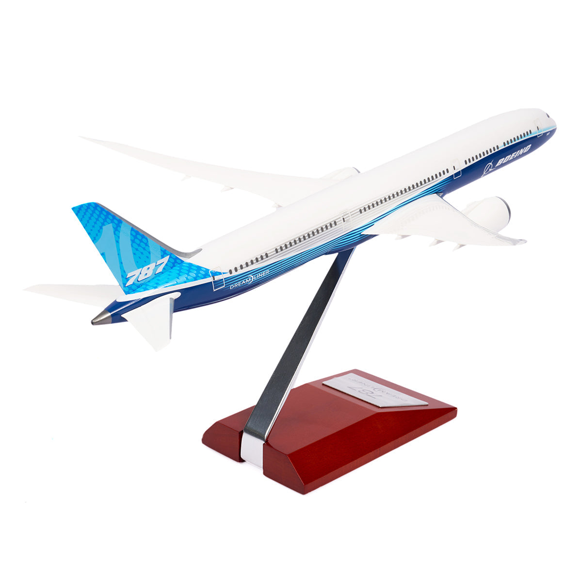 The Boeing Store presents the Boeing Unified 787-10 Dreamliner 1:200 Model, featuring a blue and white design on a sleek metal stand with a red wooden base.