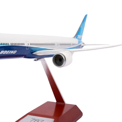 Close-up of a Boeing Unified 787-10 Dreamliner 1:200 Model from The Boeing Store, displaying its sleek fuselage, powerful jet engine, and elegant tail fin in the iconic blue and white Boeing 787 color scheme.