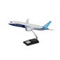 The Boeing Store’s Boeing 787-8 Dreamliner Plastic 1:144 Model features blue and white livery and is displayed on a metal stand, highlighting the jetliner’s advanced composite materials and fuel efficiency.