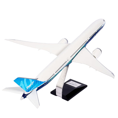 The Pacific Miniatures Boeing Unified 787-10 Dreamliner Plastic 1:144 Model features a white body, blue accents, “787” on the tail, and is presented on a metal stand with a black base.