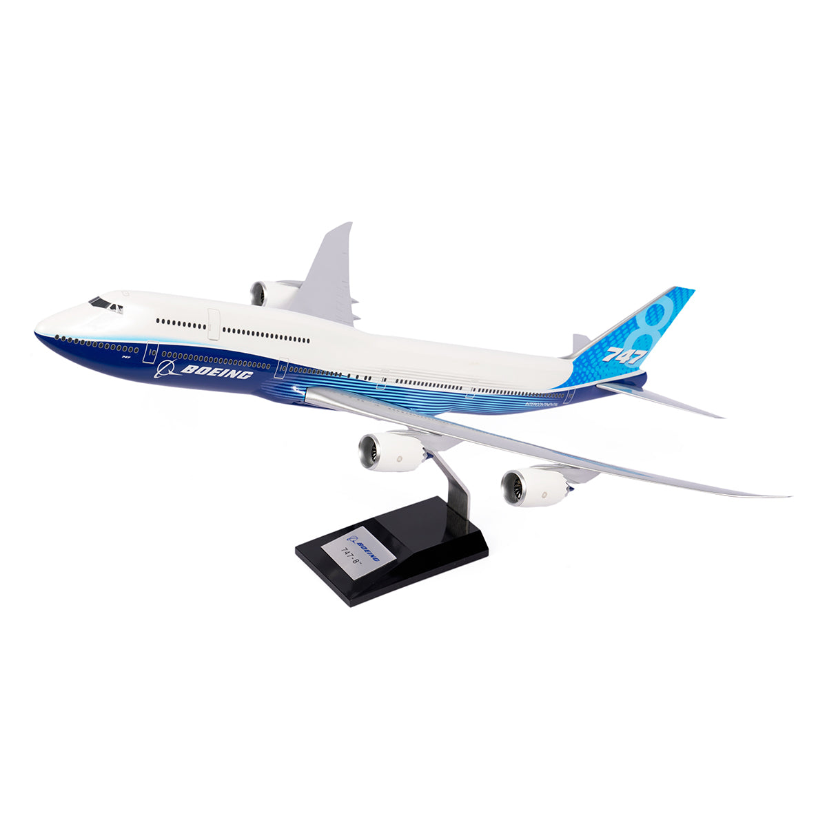 The Boeing Stores Boeing Unified 747-8i 1:144 Model features blue and white livery, a black stand with nameplate, and detailed engines and tail fin—perfect for fans of high-capacity aircraft.