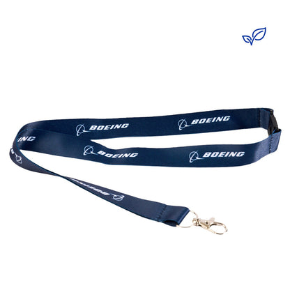 The Boeing Store's Boeing Sustainable Lanyard is made from recycled plastic bottles, features a navy blue color with the name in white, and includes a metal clasp for attaching items.