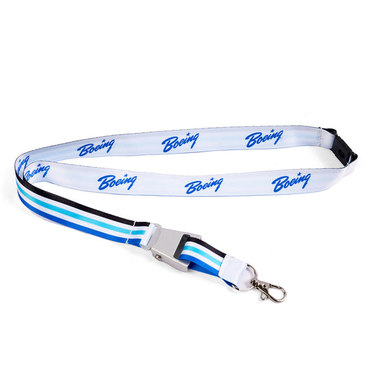 The Boeing Heritage Script Blue Seat Belt Buckle Lanyard features a white polyester strap with blue Boeing logos, blue/light blue/black stripes, a safety breakaway, metal clasp, and detachable buckle. Brand: Boeing.
