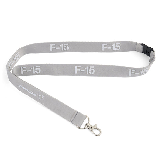 The Boeing F-15 Eagle Series Lanyard by BOEING is gray with a metal clip and features F-15 and BOEING printed in white.