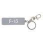 The BOEING F-15 Eagle Series Keychain features a rectangular gray design with white F-15 text, attached to a metal keyring and clasp—an ideal accessory for aviation enthusiasts.