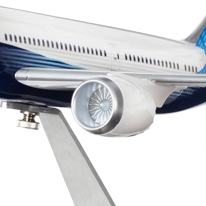Close-up of The Boeing Store’s Boeing Unified 787-9 Dreamliner Plastic 1:144 Model on a metal stand, showcasing detailed injection-molded jet engine and blue-and-white fuselage markings.