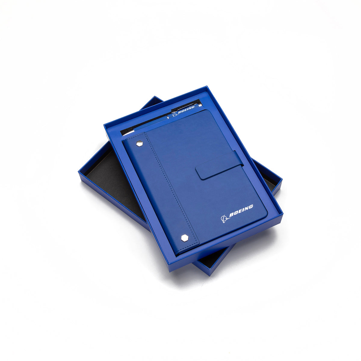 The Boeing Signature Logo Notebook Pen Set by BOEING features a PU leather notebook partially opened in a matching blue gift box, displayed on a white surface.