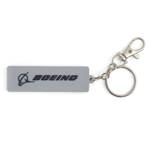 The BOEING CH-47 Chinook Series Keychain is a rectangular gray keychain with metal ring and clasp, featuring the black Boeing logo—ideal for aviation fans or CH-47 enthusiasts.