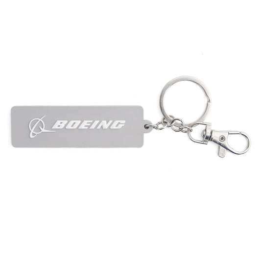 The Boeing F-15 Eagle Series Keychain by BOEING features a rectangular gray design with the logo and name in white, attached to a metal keyring and lobster clasp—ideal for aviation fans.