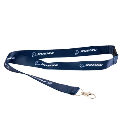 The Boeing Store's Boeing Sustainable Lanyard is made from recycled plastic bottles, features a navy blue color with the name in white, and includes a metal clasp for attaching items.