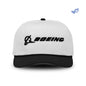 The Boeing Signature Two Tone Performance Rope Hat by BOEING features a white crown, black brim, black embroidered BOEING and logo on the front, is made from recycled moisture-wicking polyester, and shown against white with a blue leaf icon in the top right corner.