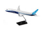 The Boeing Stores Boeing Unified 787-9 Dreamliner Plastic 1:144 Model features blue and white livery, a black stand, and is displayed against a plain white background.